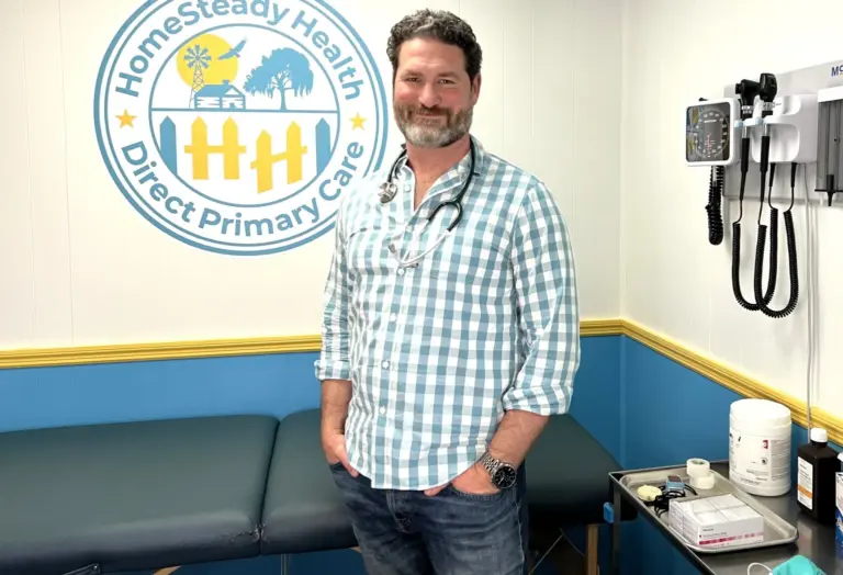 Matthew Simone, FNP-BC, standing in an exam room at HomeSteady Health