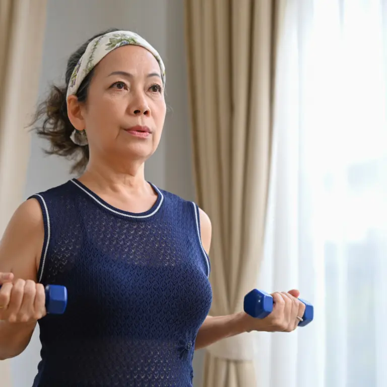 Older woman exercising with hand weights