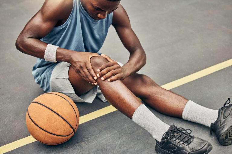 Black man with an injured knee needing urgent care