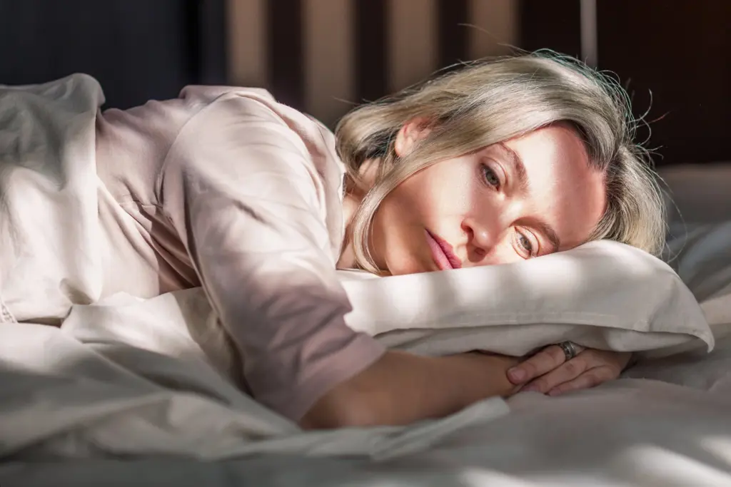 Woman sleeping on a white pillow