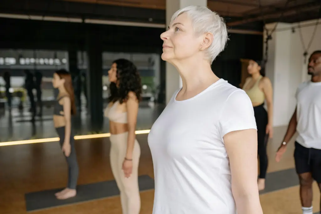 Older woman taking part in a group fitness class